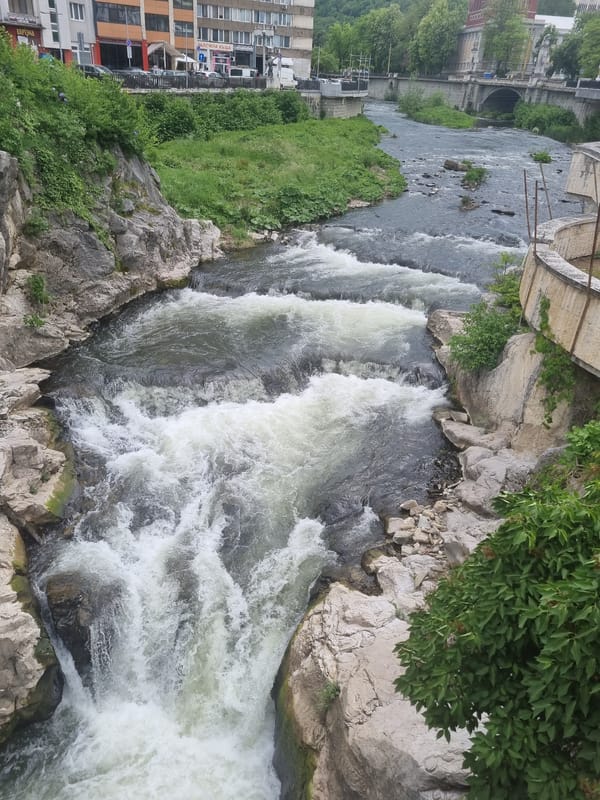 Tourist captures Gabrovo landmarks during afternoon walk through Bulgarian city
