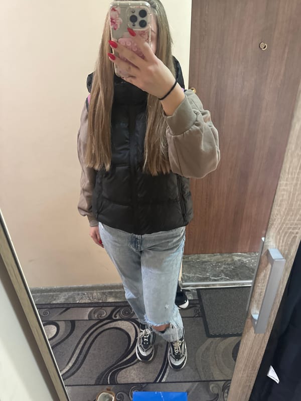 Woman takes early morning selfies in Montana, Bulgaria apartment