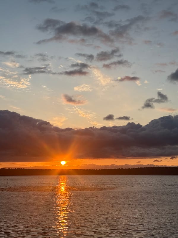 Sunset over water and handmade wreaths, Vsevolozhsk