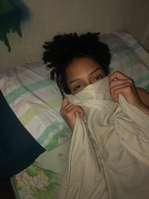 Person observed in bed with patterned sheet in Buenos Aires