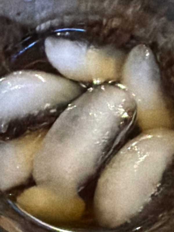 Woman relaxes on sofa with iced drink in Strasbourg