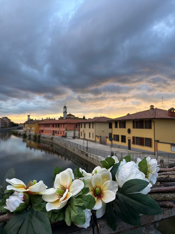 Canal views documented in Bonirola, Italy during evening hours