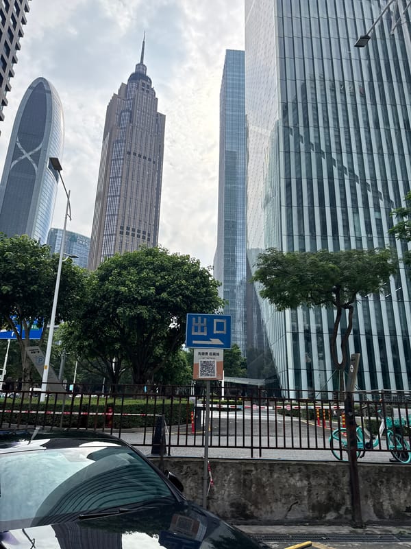 Street-level and sky-facing views of Tianhe District's tower clusters
