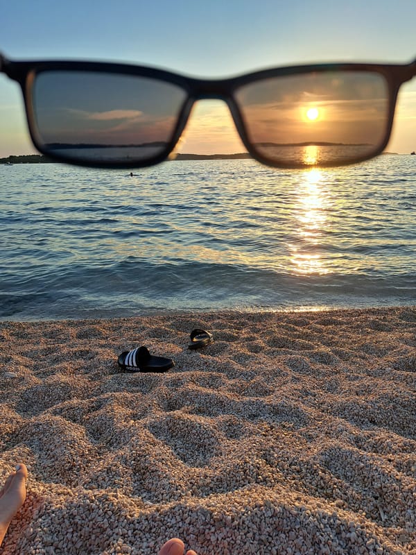 Golden hour on a pebble beach, sunset swims and shoreside chill