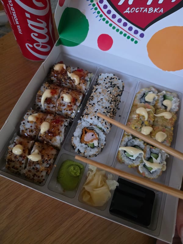 Sushi, fruit, and a Coke in a Sofia food post