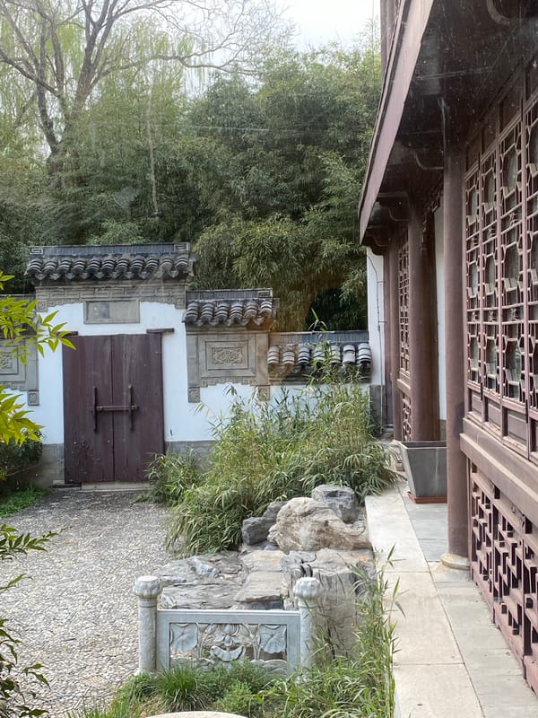 Traditional Chinese garden visit features cats, waterfalls, art displays