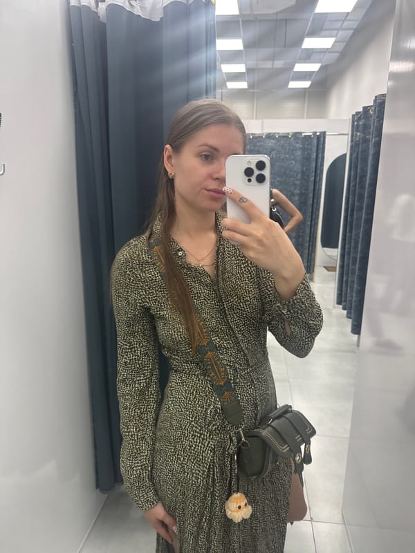 Woman takes selfies while trying on clothes in Batumi