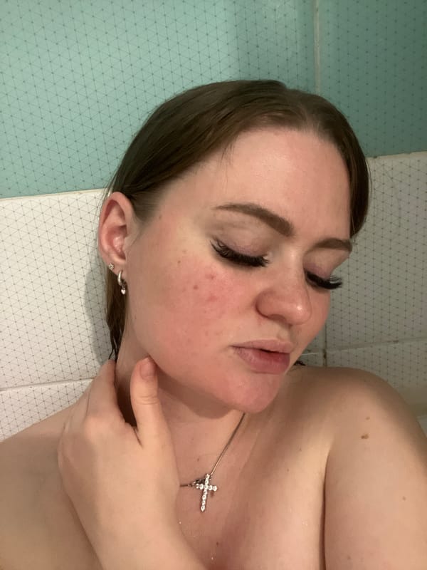 Woman relaxes in bathtub in Sevastopol bathroom
