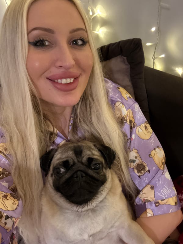Cozy evening at home with a pug in matching pajamas