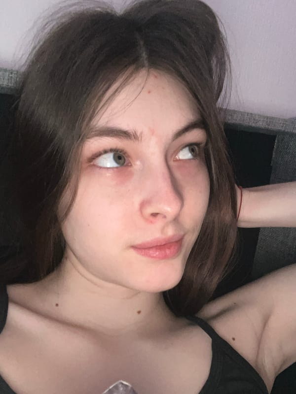 Woman captures multiple selfies in Saint Petersburg bathroom