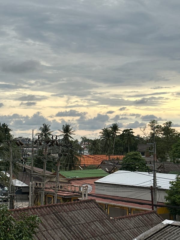 Overcast morning in Karon — rooftops, street life, and slow downtime