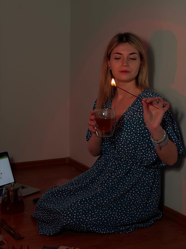 Woman conducts evening tarot reading ritual in Budva corner room