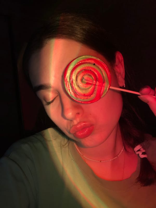 Elf ears and neon face paint under blacklight in Noviy