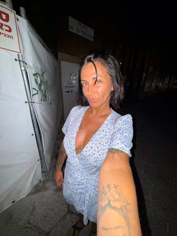 Night selfie on a cobblestone street in Tel Aviv