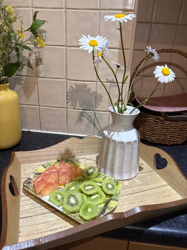 Kitchen still life with fruit and daisies observed Great Yarmouth