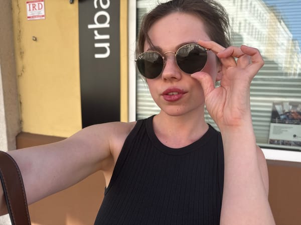 Woman takes selfies in Vienna during afternoon photo session