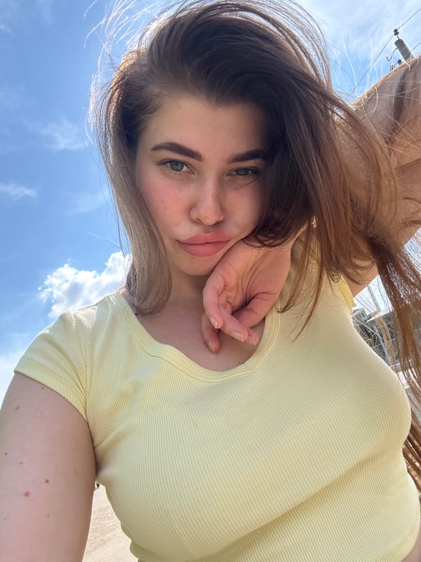 Woman photographed in yellow shirt in Troshkovo, Russia