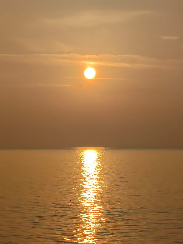 Sunset over the water in Lhokseumawe, Indonesia
