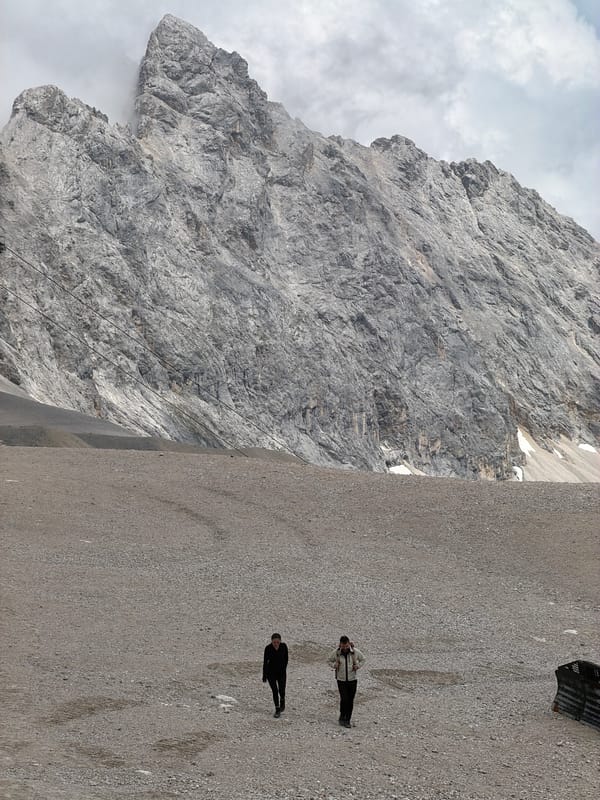Exploring the Zugspitze summit on a cloudy summer day