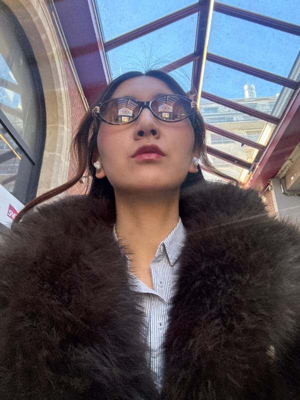 Woman takes selfies on Paris street