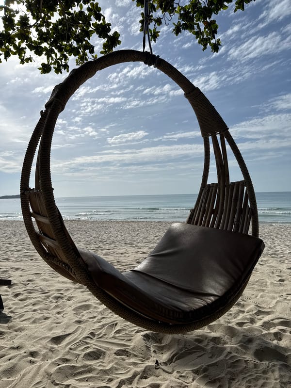 Loungers and a fishing net on a calm Ko Samui beach