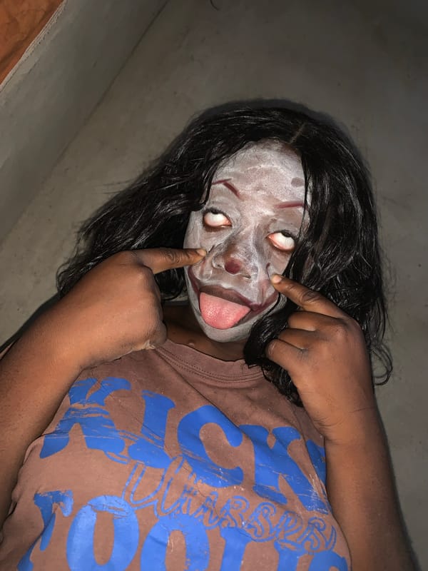 Person in theatrical makeup photographed in Agban, Nigeria