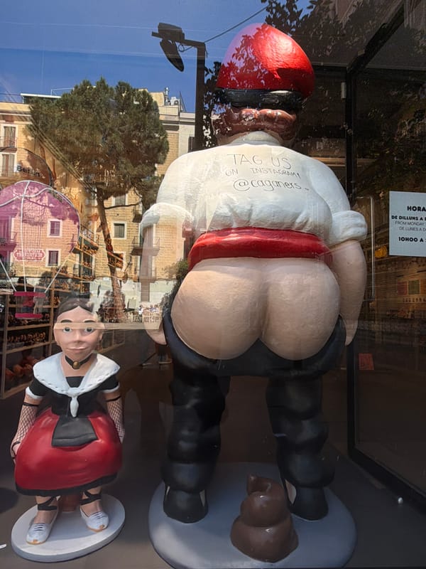 Tourist documents food and culture during Barcelona afternoon stroll