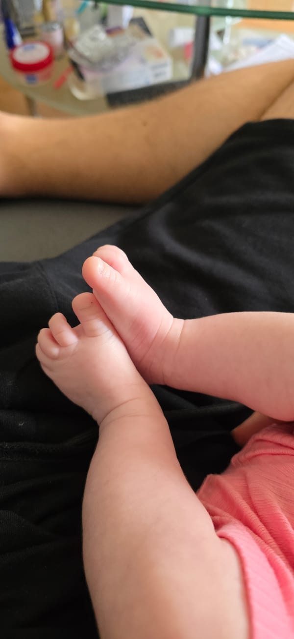 Tender moment captured between adult and baby in Munich home