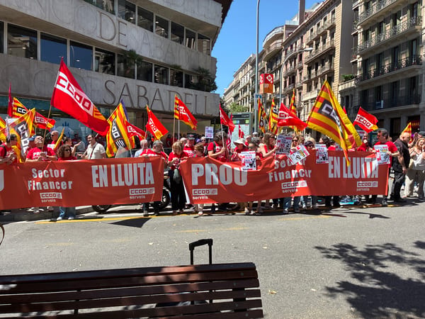 Street protest with red-shirted demonstrators unfolds in Barcelona