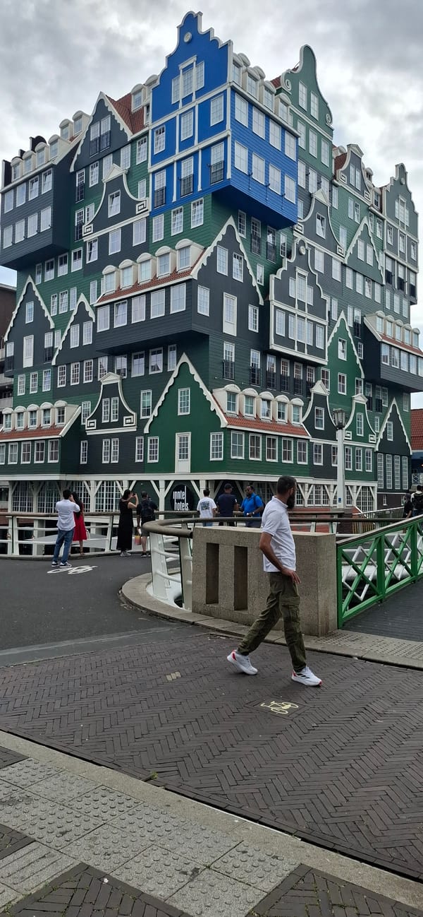 Crossing the bridge past Zaandam's iconic stacked-houses hotel