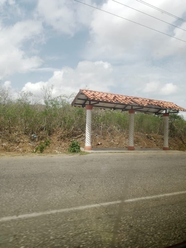 Children's schoolbooks and street scenes from rural Venezuela