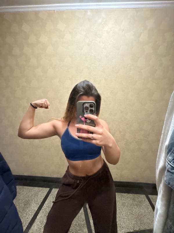 Woman takes mirror selfies in athletic wear in Sofia