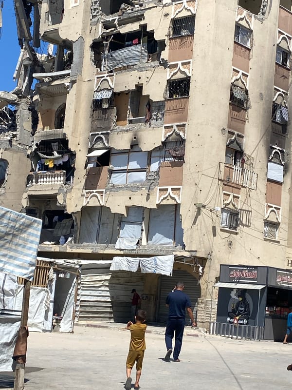 Damaged buildings and active commerce documented in Khan Yunis