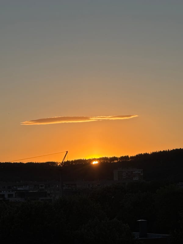 Sunset over Pernik's hills, clouds and warm light on full display