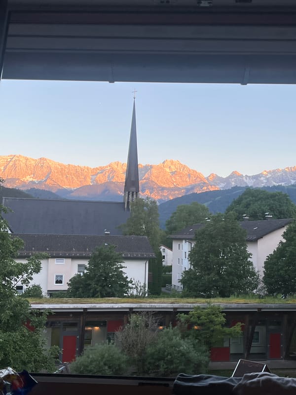 Window views captured of Garmisch-Partenkirchen church and mountains