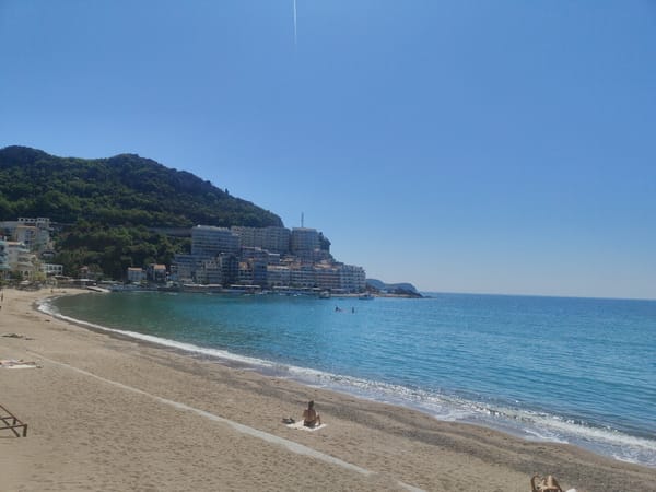 Sunny day beach relaxation captured in Rafailovići, Montenegro
