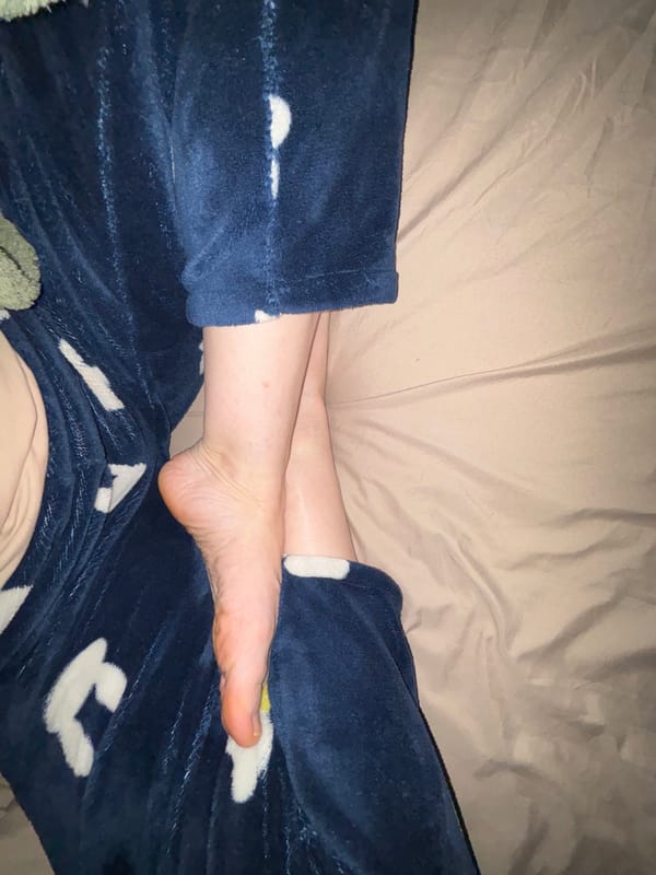 Person in blue pajamas photographed at home in Murino