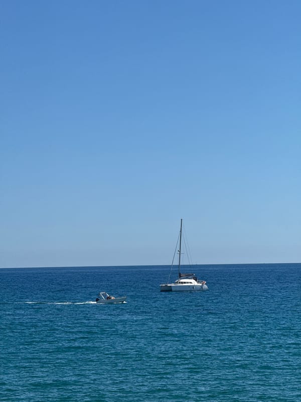 Sailboats spotted on Mediterranean near Badalona under clear skies