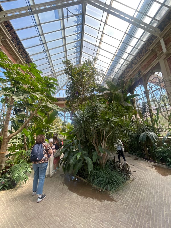 Visitors tour botanical greenhouse exhibits in Barcelona