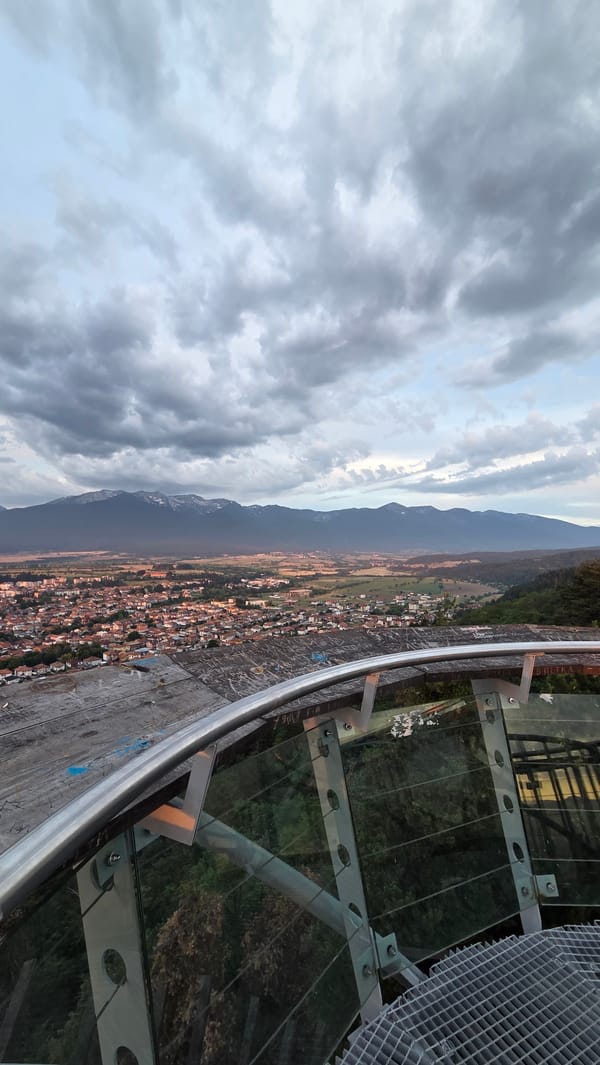 Sunset views from a graffiti-marked lookout above Razlog, Bulgaria