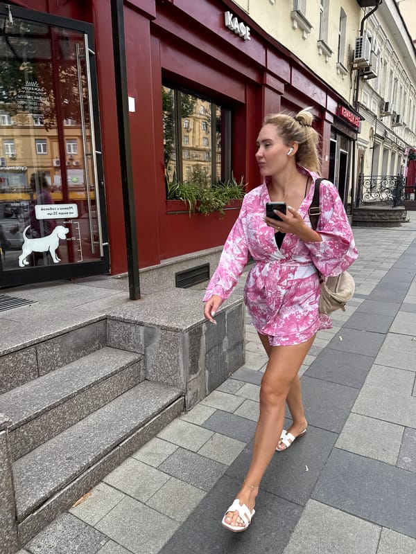 Summer street life near a Stalin-era block in central Moscow