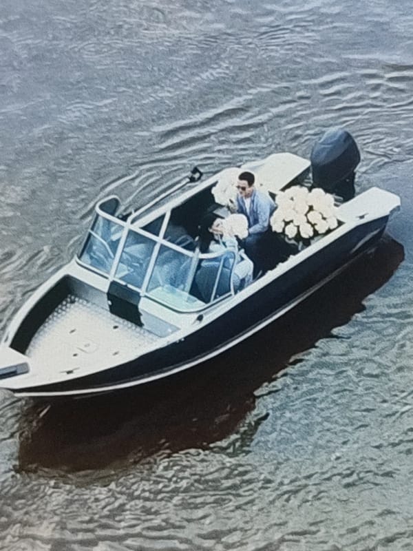 Boats on gray water, coffee brewing, and flowers in Kungur