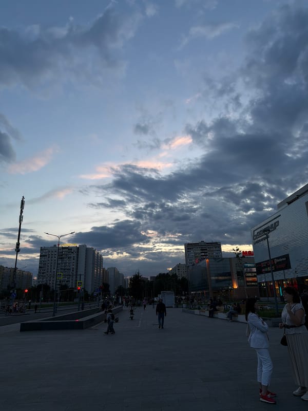 Dramatic cloudy skies observed over Moscow street scene