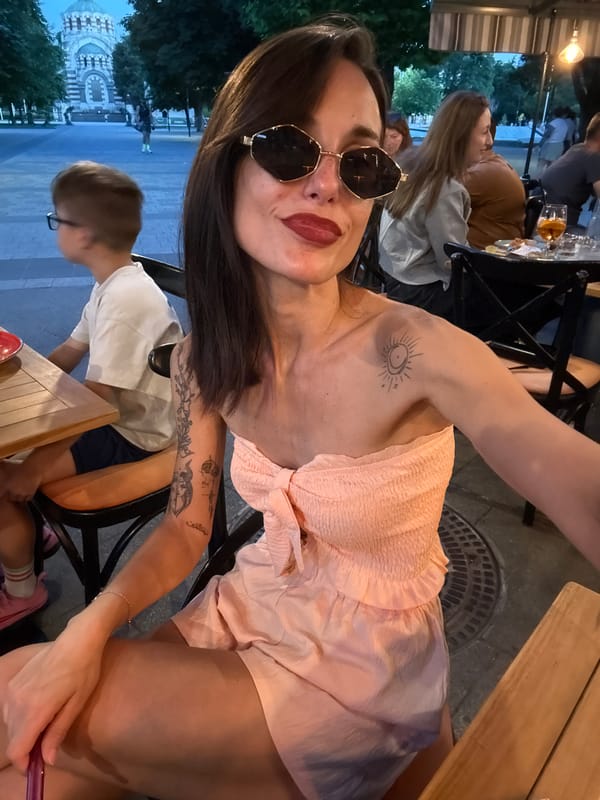Woman documents evening tour of Pleven Bulgaria fountains and parks