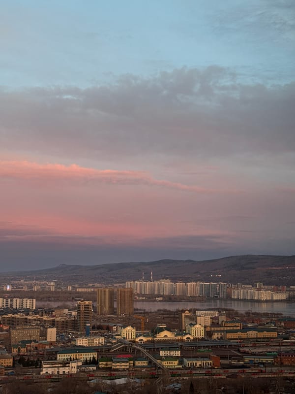 Krasnoyarsk cityscape documented during twilight transition April 27