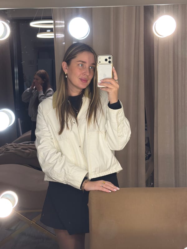 Woman takes selfie in lighted mirror in Moscow
