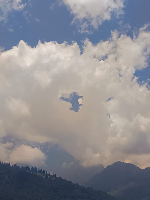 Dramatic Himalayan skies over Vashisht captured from ground and air