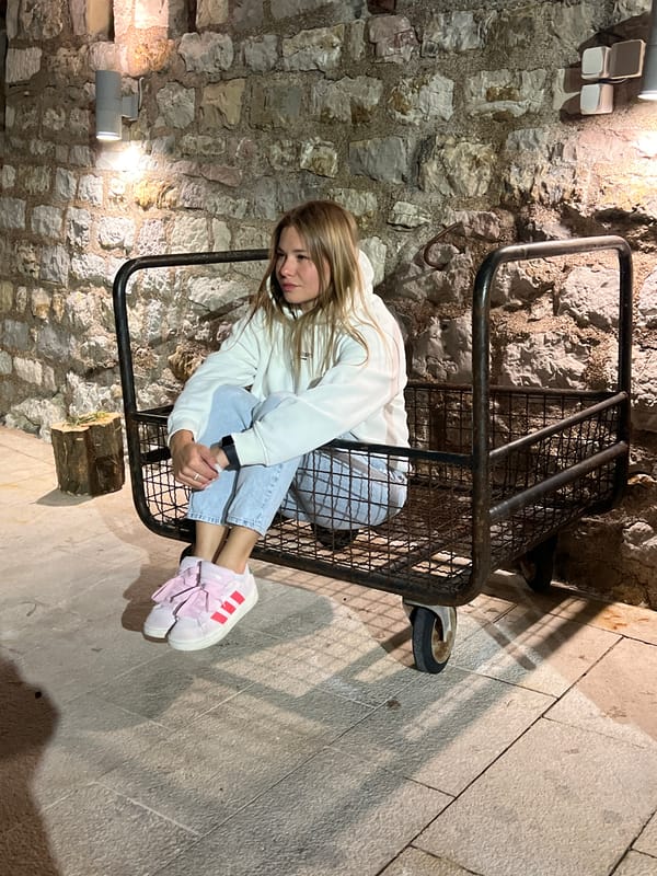 Evening stroll documented in coastal Petrovac, Montenegro resort town
