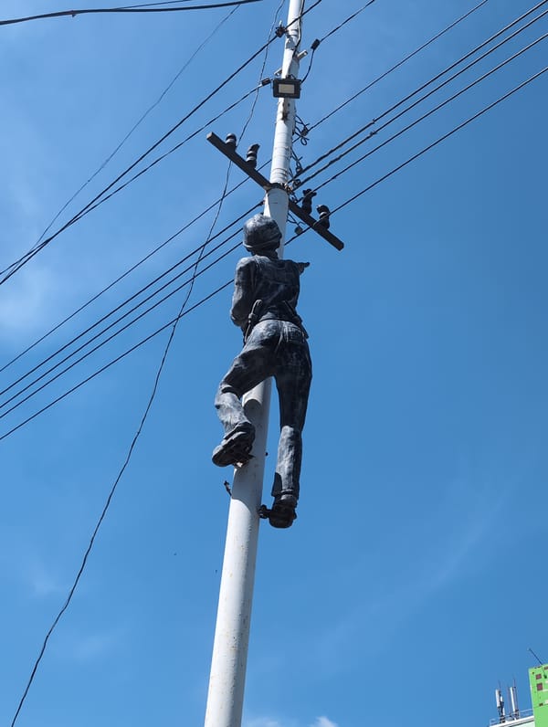Balancing man sculpture spotted on utility pole in Izhevsk