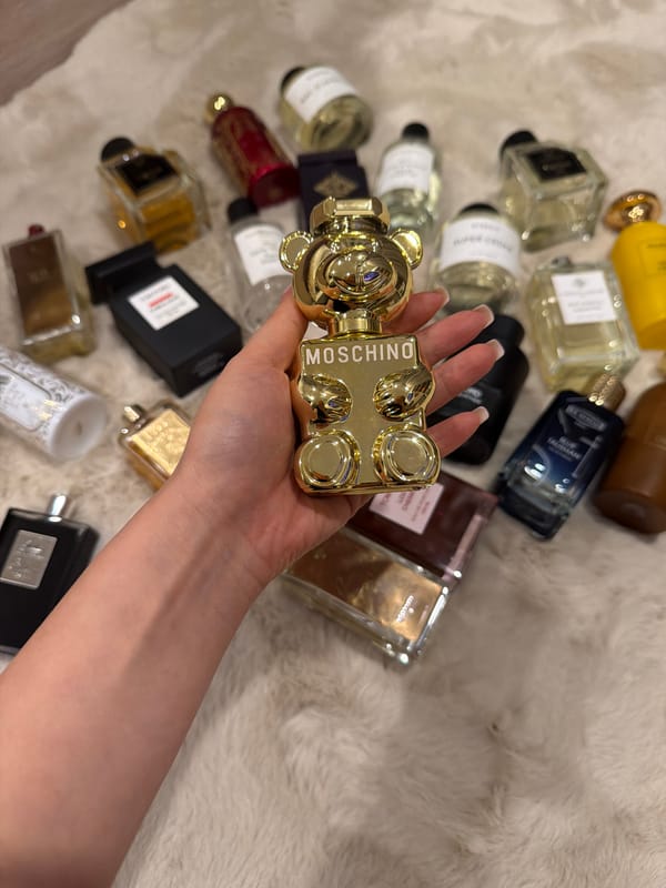 Luxury perfume collection displayed on soft surface in Thailand
